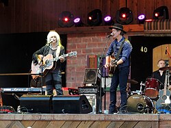 Harris teamed up with Rodney Crowell to record two albums in the 2010s. Pictured above, Crowell and Harris are seen performing in 2012.
