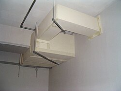Circuit integrity fireproofing of cable trays in Lingen/Ems, Germany using calcium-silicate board system qualified to DIN 4102. Other methods for exterior protection of electrical circuits include boards made of sodium silicate, bonded and pressed vermiculite, and flexible wraps made of ceramic fibre and rockwool.