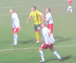 Graham (centre; yellow shirt) playing for Watford against Crystal Palace, 2011 season