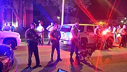 St. Louis County police protect the scene eight hours after the shooting
