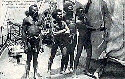 Tanna men on a boat, c. 1905
