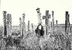 A machi photographed in a Mapuche cemetery in 1904