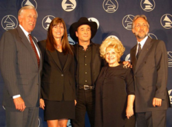 Lee poses with country artist, Clint Black, along with US Congresswoman, Steny Hoyer, and Recording Academy president, Neil Portnow (2006).