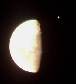 Jupiter (the bright object in the upper right) a few minutes before being occulted by the Moon on 16 June 2005.