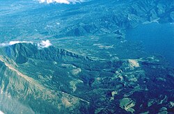 The southeastern side of Mount Iriga in the Philippines contains a large horseshoe-shaped crater formed by a sector collapse