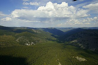 The highest of hills in this picture show fairly similar heights making up a summit accordance. Aerial photograph from the Altai region of Russia.
