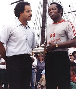 Rawls (right) at Baltimore's Inner Harbor (1980) being interviewed by local news anchor Curt Anderson, promoting the Lou Rawls Parade of Stars Telethon