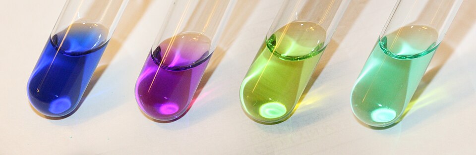 Color of various Ni(II) complexes in aqueous solution. From left to right, [Ni(NH3)6]2+, [Ni(NH2CH2CH2NH2)3]2+, [Ni(H2O)5Cl]+, [Ni(H2O)6]2+