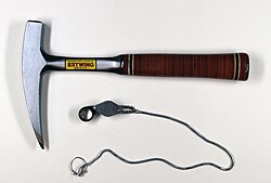 The rock hammer and hand lens (or loupe) are two of the most characteristic tools carried by geologists in the field.