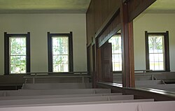 Sugar Grove Conservative Friends Meeting House, built in 1870 in Indiana, with an openable partition between male and female sections