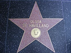 Five-pointed star with her name and an image of an old film camera