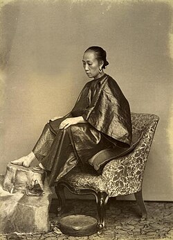 Woman with bound feet, 1870s