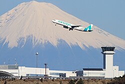 Shizuoka Airport is overlooked by Mount Fuji.