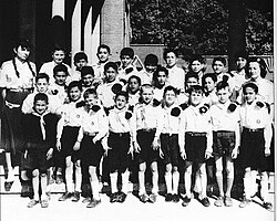 Farah (on the left) with Iranian Boy Scouts in Paris, (c. 1956)