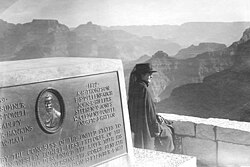 Maud Powell, niece of John Wesley Powell, photographed at his monument, Grand Canyon, Arizona, 1918