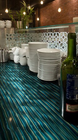 Ribbons of colored glass fused into a solid slab