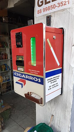 A cigarette dispenser in Canoa Quebrada, Brazil selling individual cigarettes for R$1 in 2024