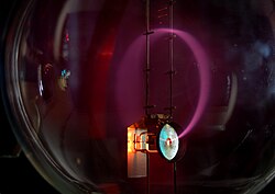 The Lorentz force law in effect: electrons are bent into a circular trajectory by a magnetic field.