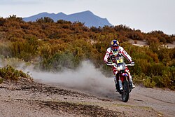 Joan Barreda racing a Honda motorcycle at the 2016 Dakar Rally