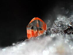 Orange forsterite with a portion of tephroite