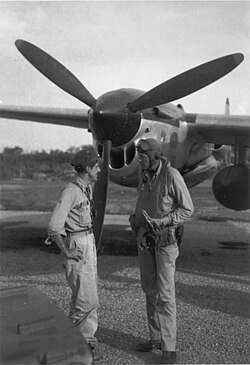 Lindbergh with ace Thomas McGuire on Biak Island in 1944. The aircraft is a P-38 Lightning