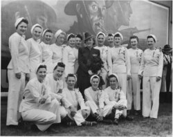 Mary Pickford posing with a group of employees during her visit to the General Engineering Company (Canada) munitions factory on June 5, 1943