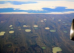 Permafrost thaw ponds on peatland in Hudson Bay, Canada in 2008.[98]