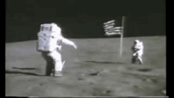 Astronaut John Young jumping on the Moon, illustrating that the gravitational pull of the Moon is approximately 1/6 of Earth's. The jumping height is limited by the combined weight of Young and his EVA space suit on the Moon of about 27 kg (60 lb) and by the suit's pressurization resisting the bending of the suit, as needed for jumping.[89][90]