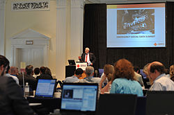 U.S. Federal Emergency Management Agency (FEMA) Administrator W. Craig Fugate speaking at a Red Cross seminar on using social media during natural disasters. GIS has an integral role to play in such agendas.
