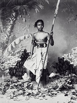 19th-century studio portrait of a native Javanese warrior with an iron kris-tipped spear