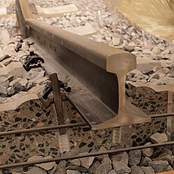 Cross section of a concrete railway sleeper below a rail