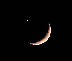The natural phenomenon of a conjunction of the crescent Moon and, in this case, Venus; respectively the second and third brightest natural objects in Earth's sky