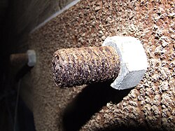 Corrosion on exposed metal, including a bolt and nut