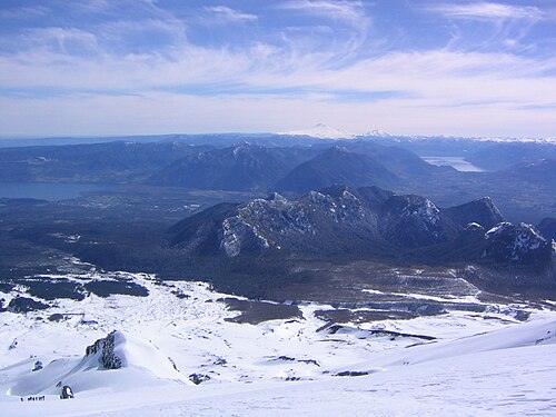 Pucón is visible in the left center of the image. Llaima can be seen in the distance.