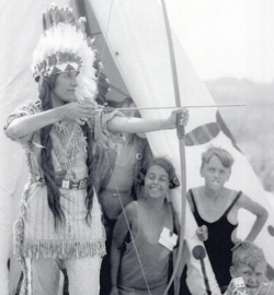 Rosebud Yellow Robe demonstrating how to use a bow and arrow at the Indian Village, Jones Beach State Park, Long Island, New York, 1933