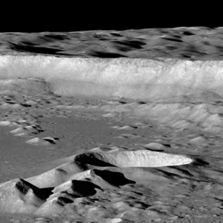 Oblique view of part of the interior of Antoniadi from LRO. The smaller crater near the center of the image contains the lowest point on the moon.[3]