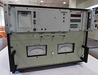 A caesium atomic clock from 1975 (upper unit) and battery backup (lower unit)[19]