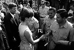 President Kennedy and Jacqueline Kennedy greet members of the 2506 Cuban Invasion Brigade at Miami's Orange Bowl; c. December 29, 1962