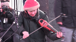 Anderson performing outdoors at Times Square in New York City, 2016