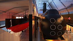 Two widely different generations of Swedish submarines but both with diesel–electric transmission: HSwMS Hajen [sv], in service 1905–1922, and HMS Neptun, in service 1980–1998