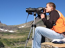Scanning the cliffs near Logan Pass for mountain goats as part of the Glacier National Park Citizen Science Program