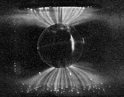 Laboratory simulation of the magnetosphere's influence on the solar wind; these aurora-like Birkeland currents were created in a terrella, a magnetised anode globe in an evacuated chamber.