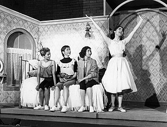 L–R: Elizabeth Taylor,[106] Carmen Gutierrez, Marilyn Cooper, and Carol Lawrence from the original Broadway cast sing "I Feel Pretty" (1957)