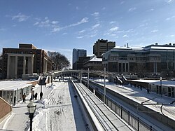 East Bank campus in winter. Ford Hall on the left, Nils Hasselmo Hall on the right of the light rail.