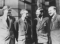 Key British physicists. Left to right: William Penney, Otto Robert Frisch, Rudolf Peierls and John Cockcroft. They are wearing the American Medal of Freedom.