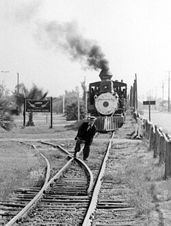 Keaton getting his foot stuck in railroad tracks at Knott's Berry Farm in 1956