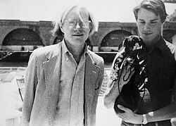 Warhol and his partner Jed Johnson with their dachshund Archie at the port of Amalfi, 1973