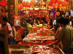 Shoppers at a New Year market in Chinatown, Singapore