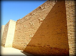 Mušḫuššu (sirrush) and aurochs on either side of the processional street. Ancient Babylon, Mesopotamia, Iraq.