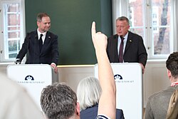 A journalist wanting to ask a question at a press conference